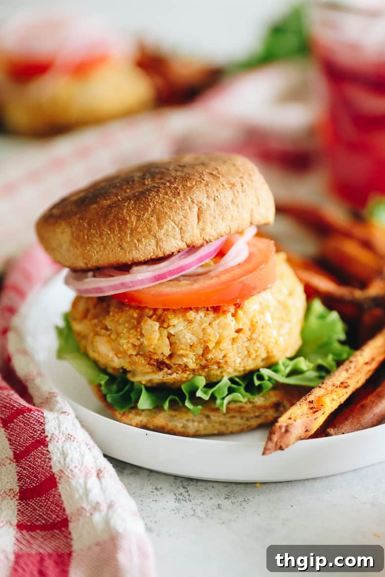Wholesome Quinoa Veggie Burgers 9 A freshly made quinoa burger with toppings and a side of fries.