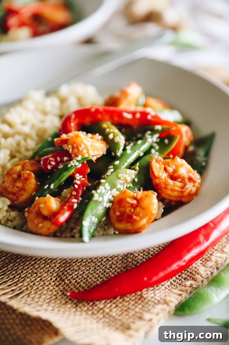 Sizzling Sesame Shrimp with Crisp Vegetable Stir-Fry 2 A vibrant, delicious sesame shrimp and veggie stir fry, ready to be served