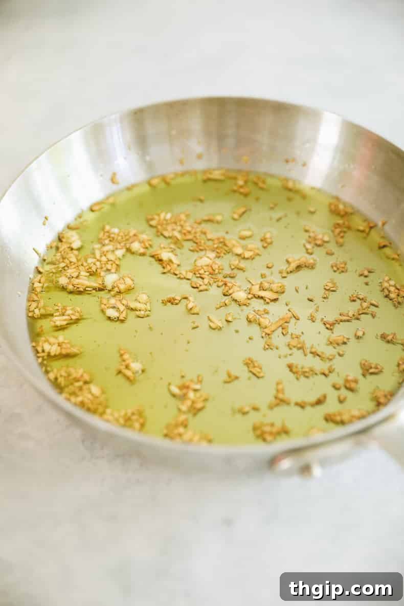 Verdant Kale Pesto Pasta 5 Golden brown pan-fried garlic sizzling in a small amount of olive oil.