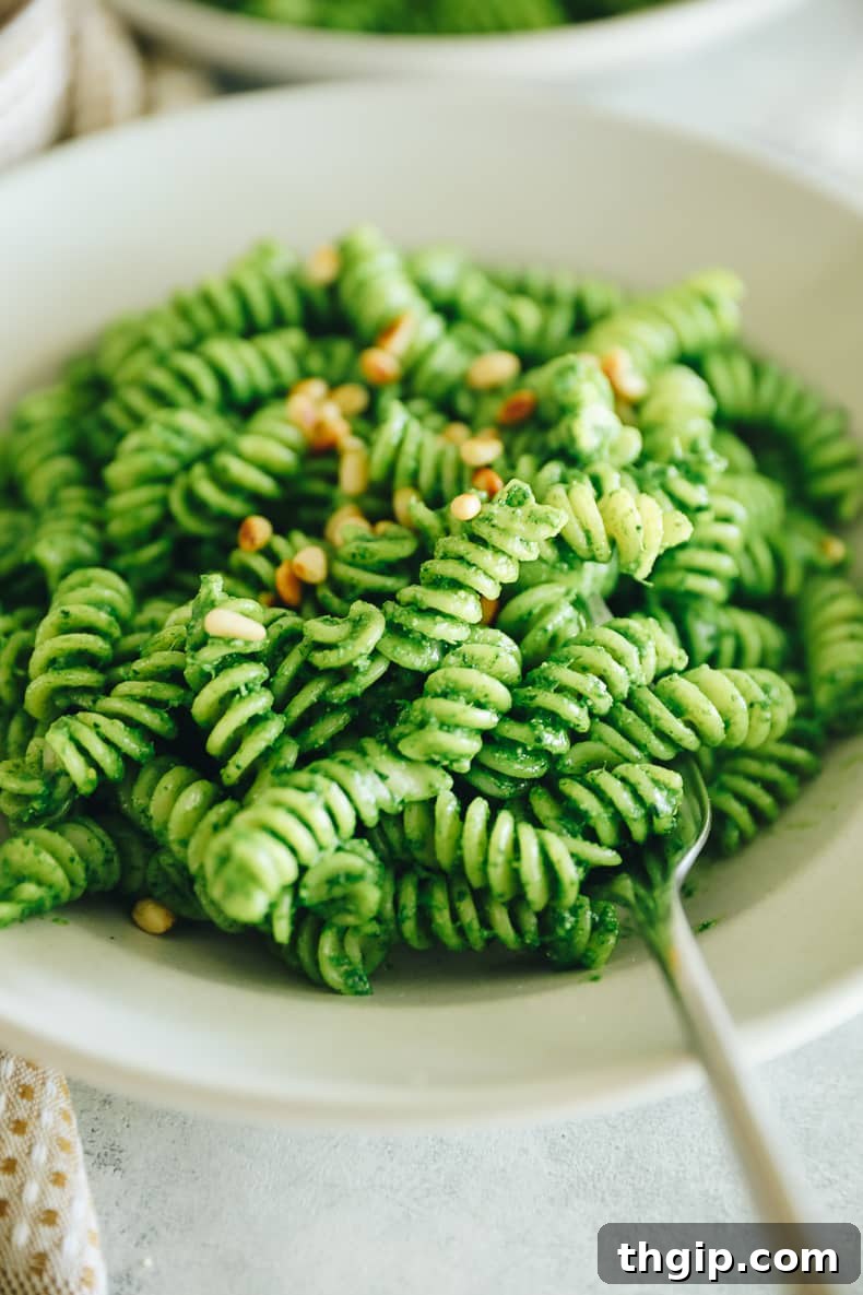 Verdant Kale Pesto Pasta 7 A serving of kale pesto pasta in a bowl, perfectly coated with sauce.