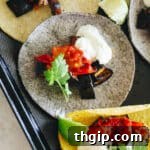 eggplant tacos laid flat on a baking tray