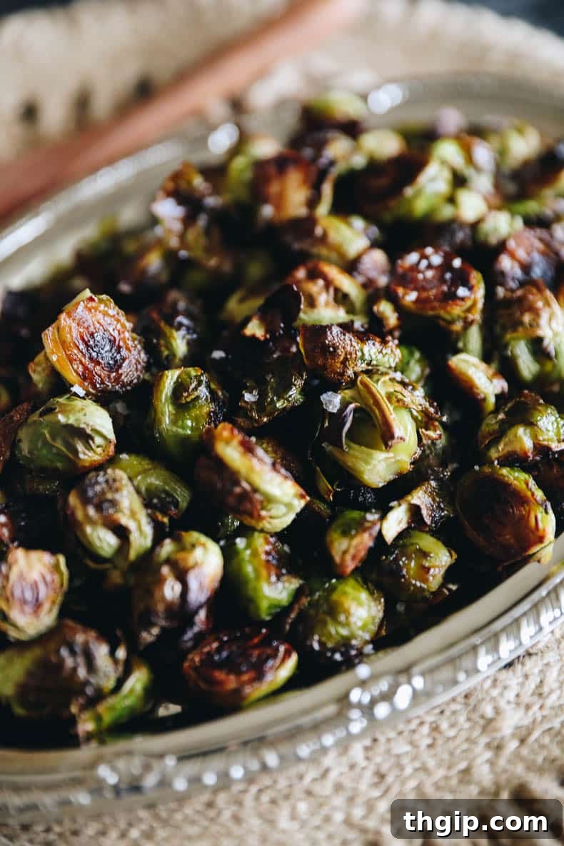 Close-up shot of fresh, vibrant green Brussels sprouts, ready for preparation.