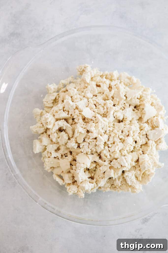 Savory Tofu Bolognese Pasta 4 Crumbled extra-firm tofu in a clear bowl, ready to be cooked for a vegan pasta sauce.