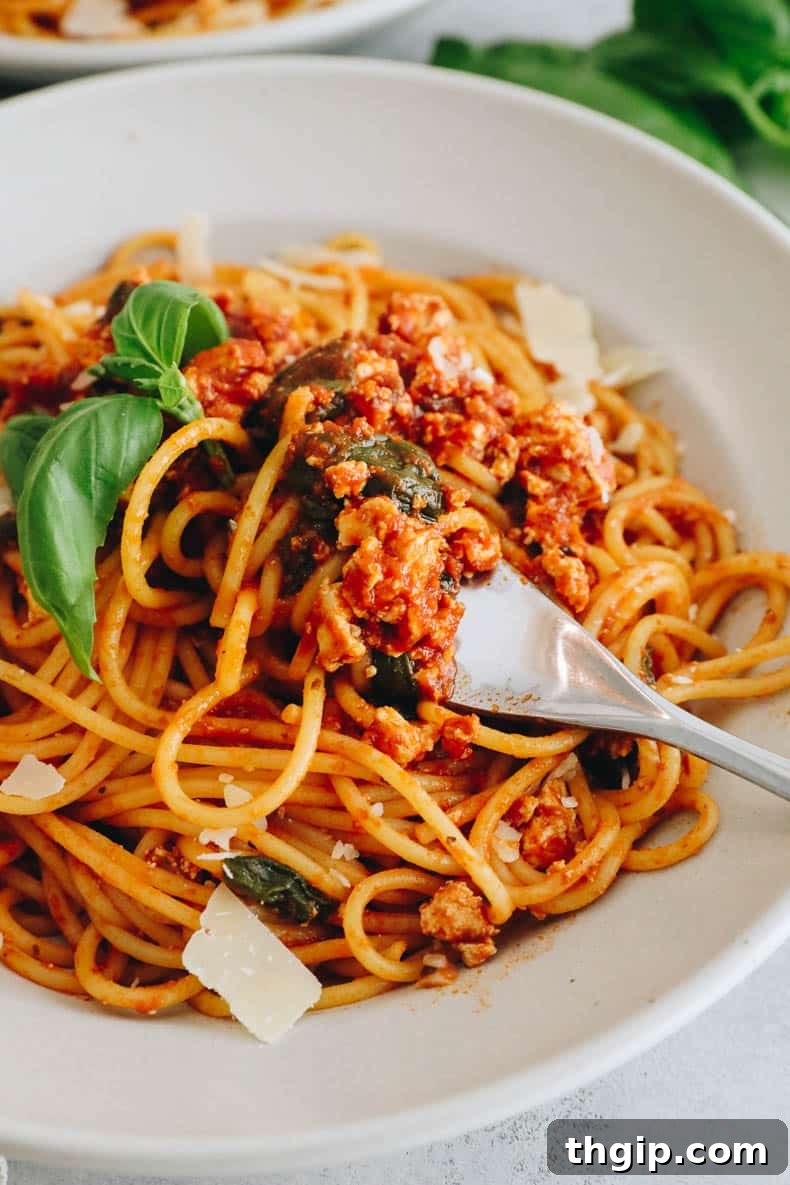 Savory Tofu Bolognese Pasta 7 A large pot of cooked pasta coated in vegan tofu bolognese sauce, ready to be served.