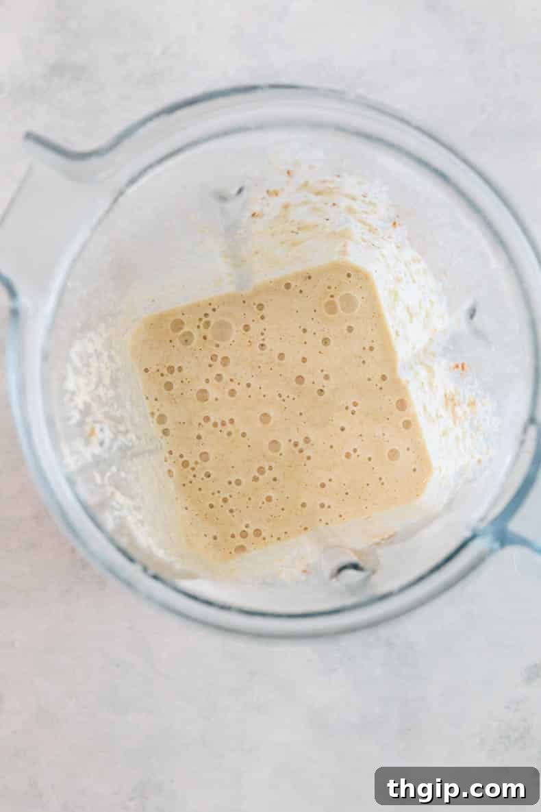 Smooth baby banana pancakes batter in a blender, showing the creamy texture.