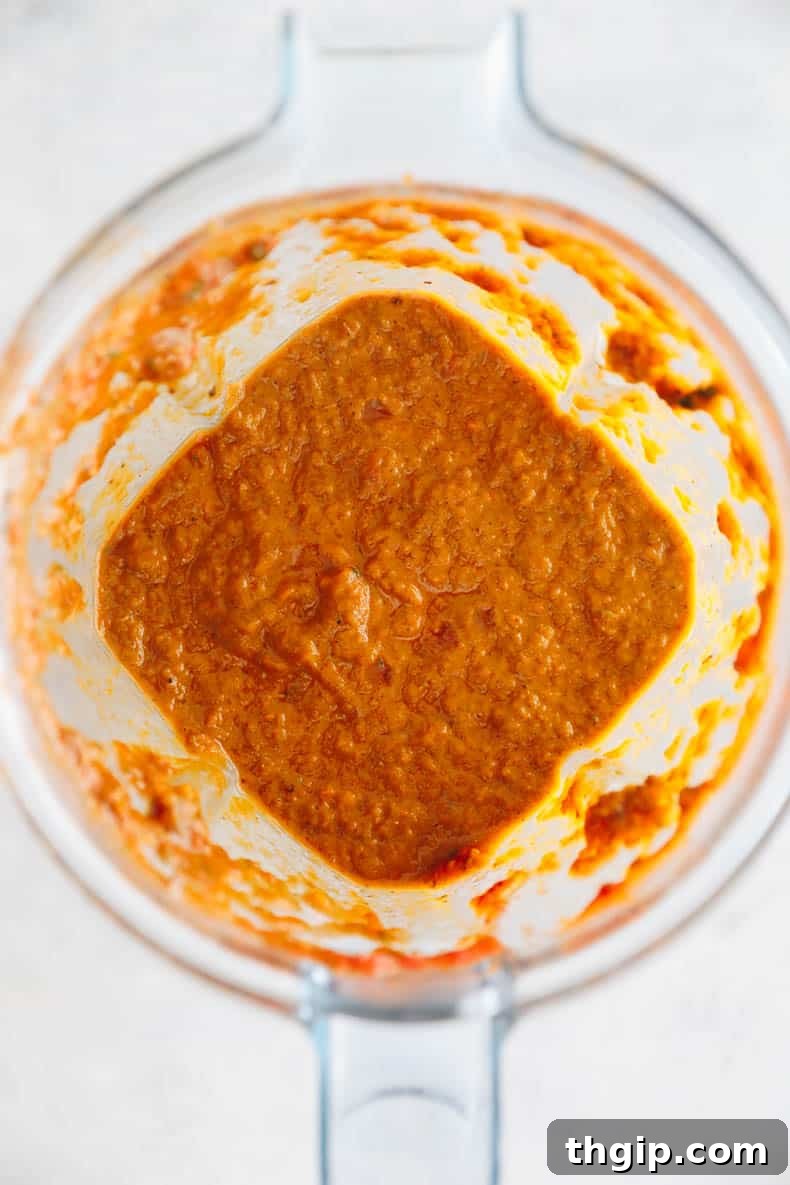 Secret Garden Pasta Sauce 6 Smooth, blended hidden veggie pasta sauce swirling in a blender, ready for serving.