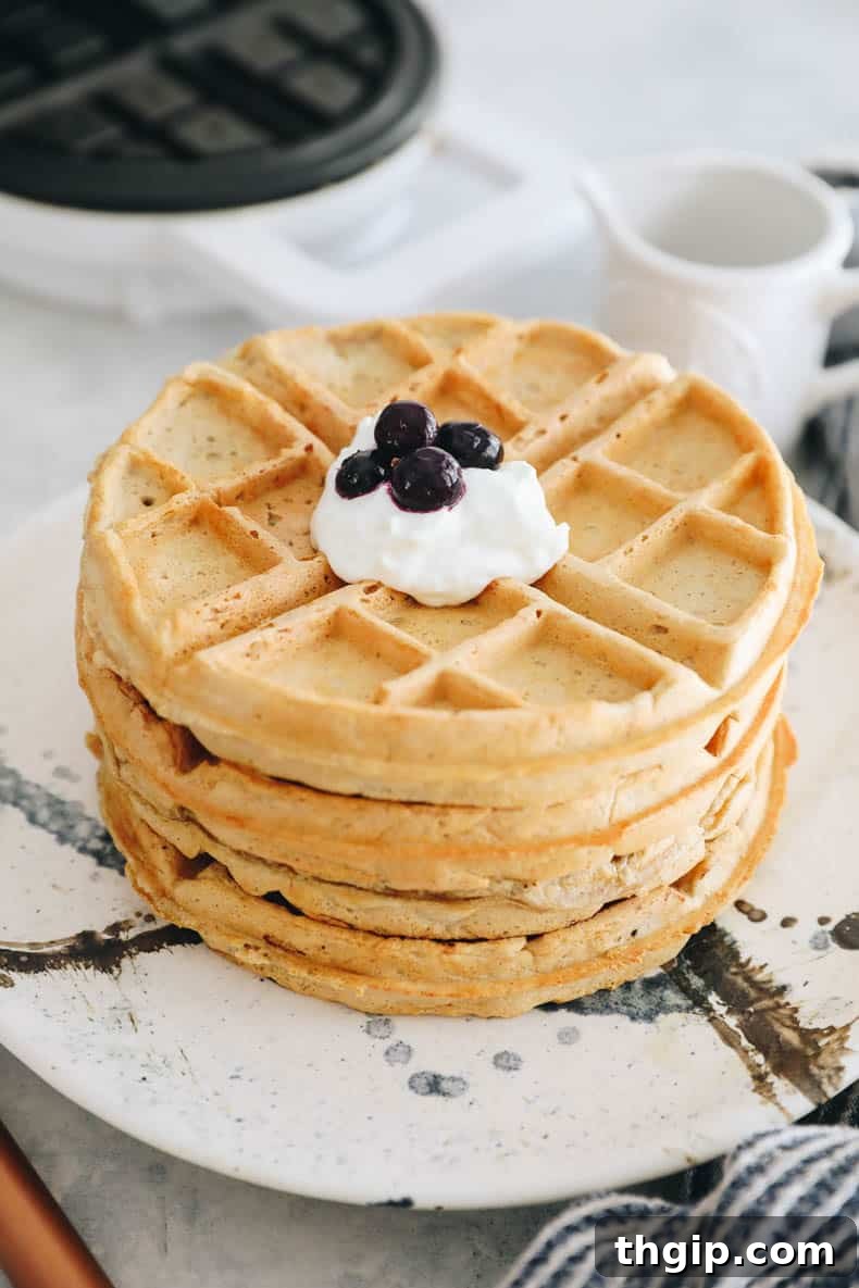 Protein Power Waffles 2 Stack of waffles topped with Greek yogurt and blueberries.
