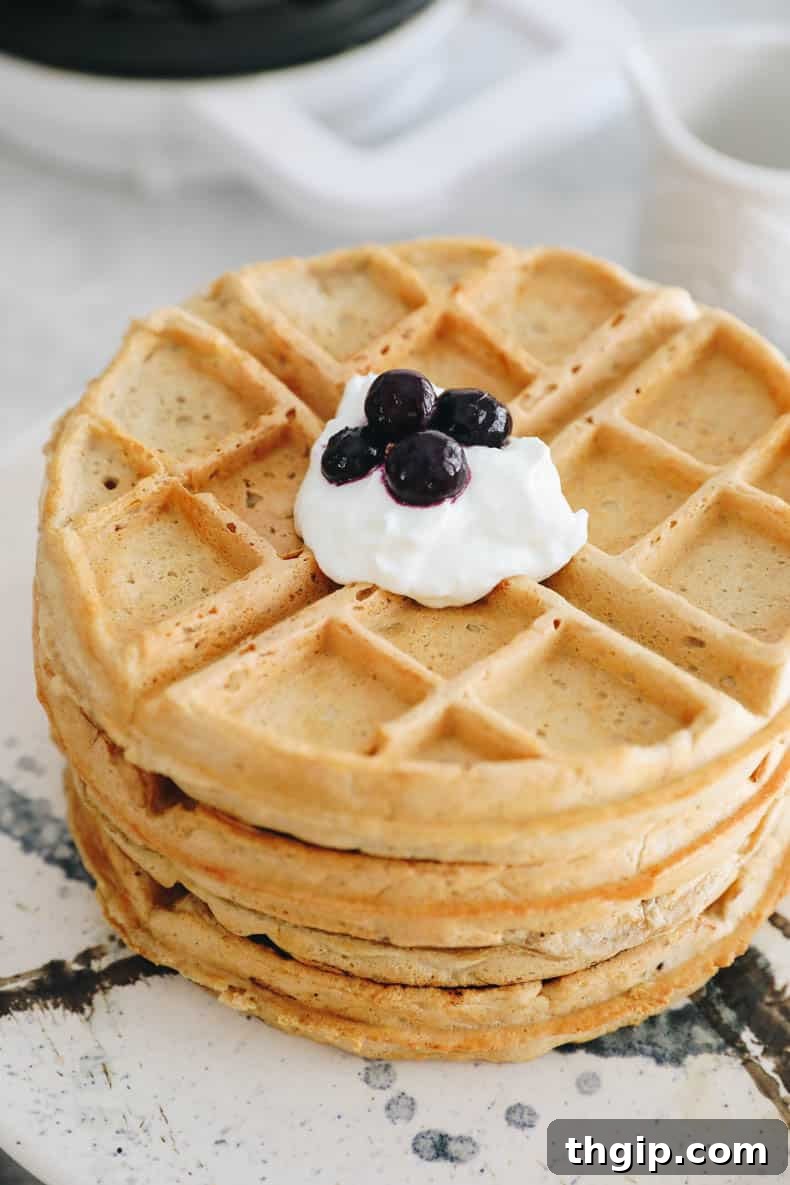 Protein Power Waffles 8 stack of protein waffles topped with greek yogurt and blueberries