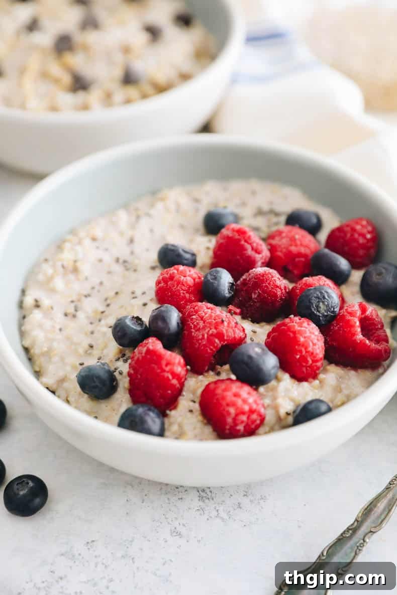 steel cut oats in a bowl with blueberries, raspberries and chia sseds.