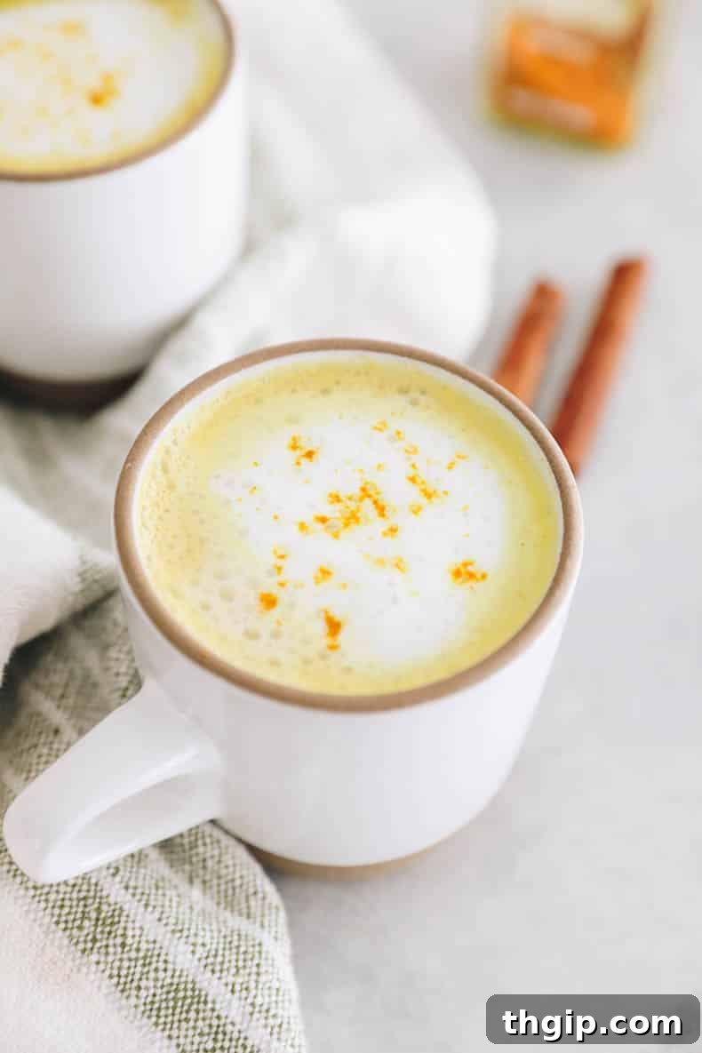 Golden Turmeric Elixir 4 A delicious turmeric latte poured into a mug, ready to be enjoyed.