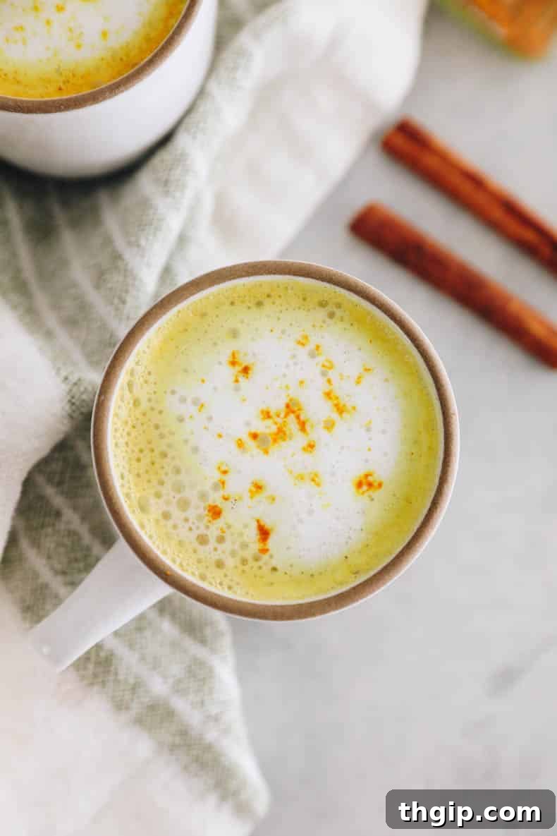 Golden Turmeric Elixir 6 Close-up of the beautiful golden color and creamy texture of a homemade turmeric latte.
