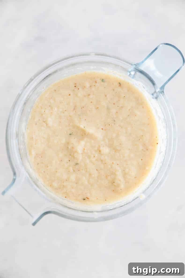 Golden Roasted Cauliflower Soup 5 roasted cauliflower soup blended up in a blender.