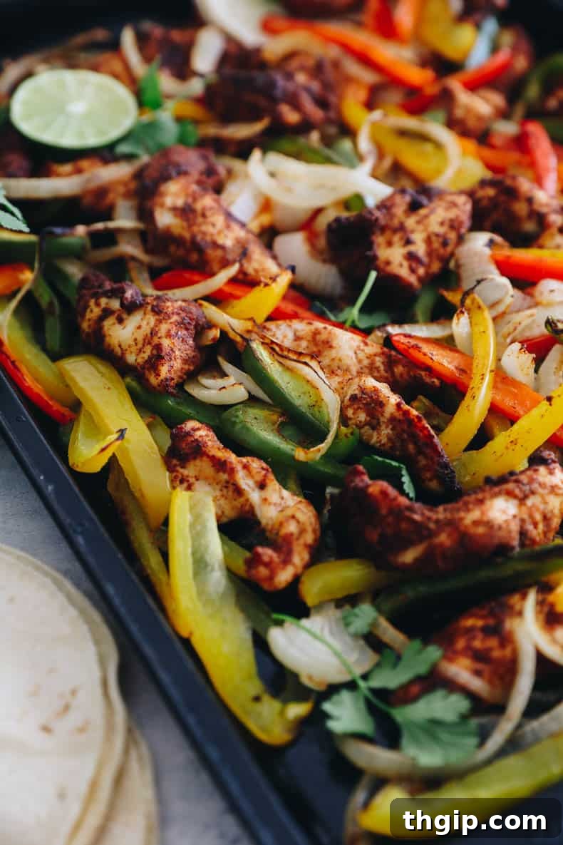 Effortless Fajita Feast 8 Close-up of a prepared sheet pan chicken fajita, showcasing the vibrant colors and appealing texture.