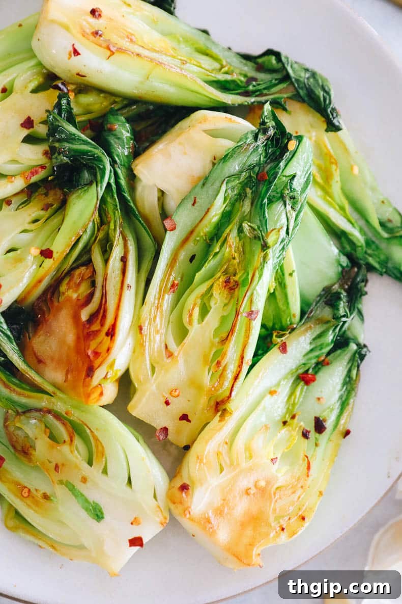 Garlicky Baby Bok Choy Sauté 6 Garlic baby bok choy recipe beautifully arranged on a plate.
