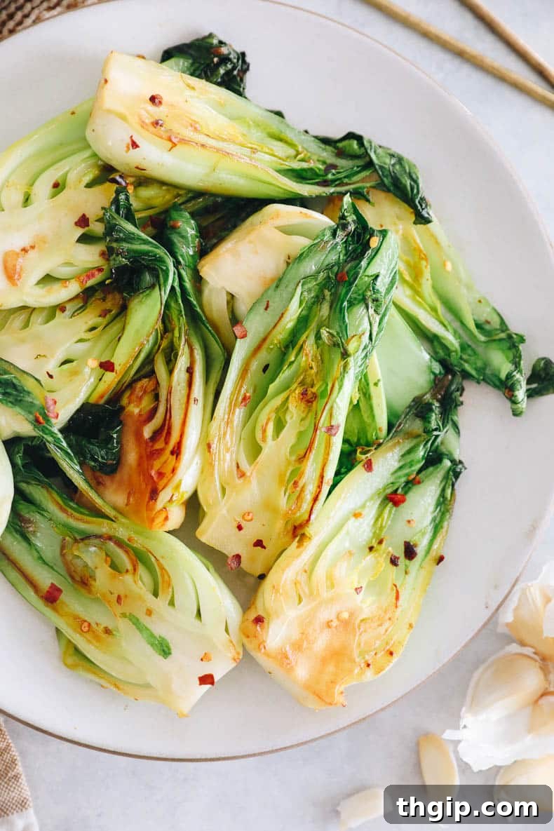 Garlicky Baby Bok Choy Sauté 8 A final close-up of the delicious garlic baby bok choy, garnished with red pepper flakes.