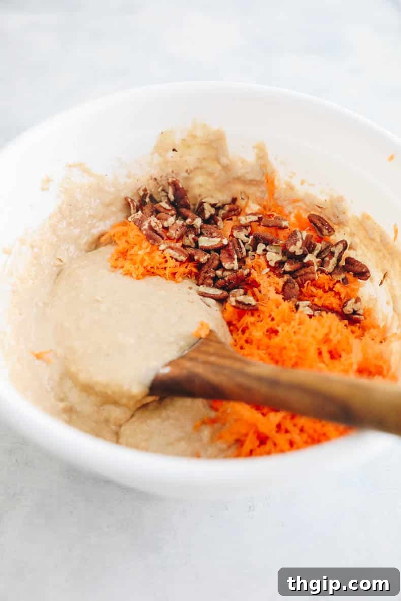 Carrot Cake Bites 4 Carrot cake muffin batter in a large bowl.