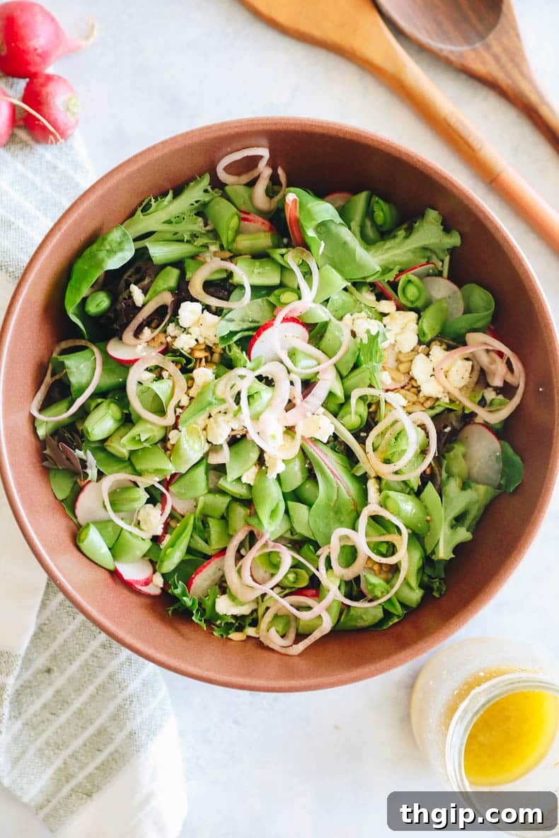 Vibrant Green Medley 2 spring mix salad in a large brown bowl.