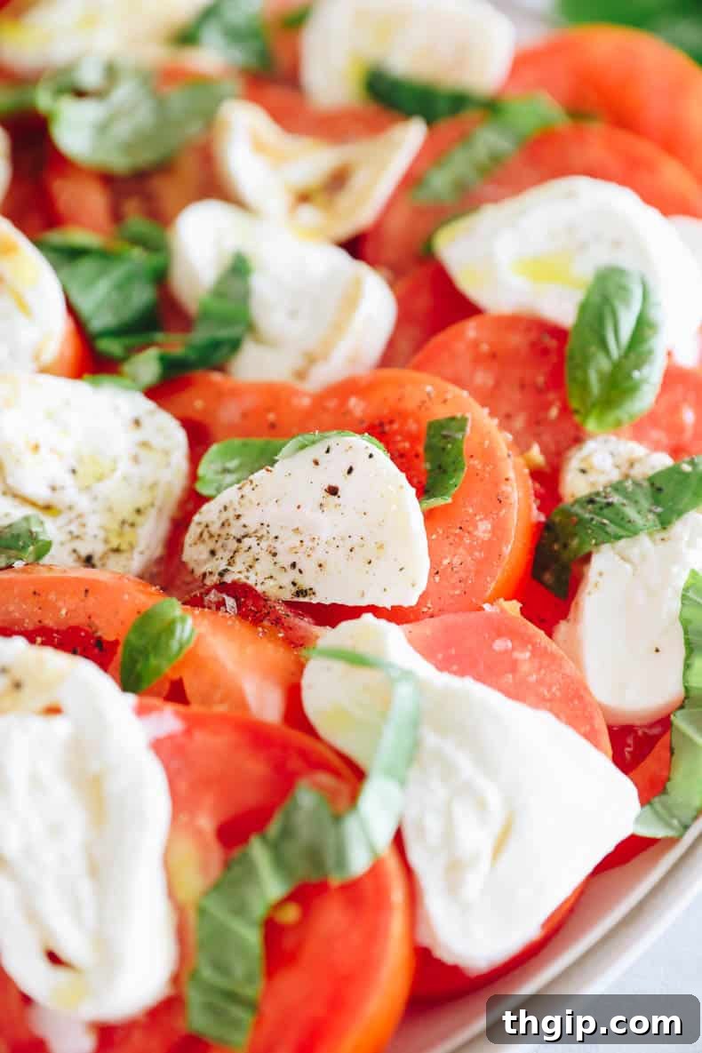 An overhead shot of a fresh and vibrant burrata salad, beautifully plated and ready to be enjoyed.