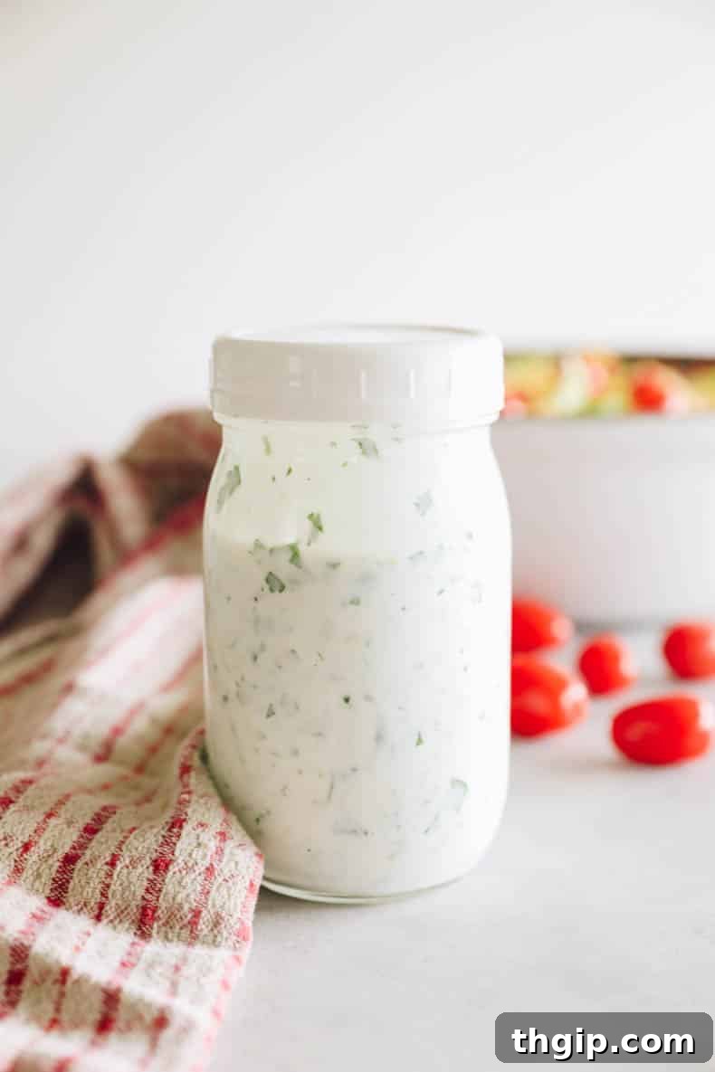 Greek yogurt ranch dressing in a mason jar.
