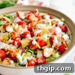 Copycat Panera Bread BBQ Chicken Salad in a large salad bowl with greek yogurt ranch dressing.