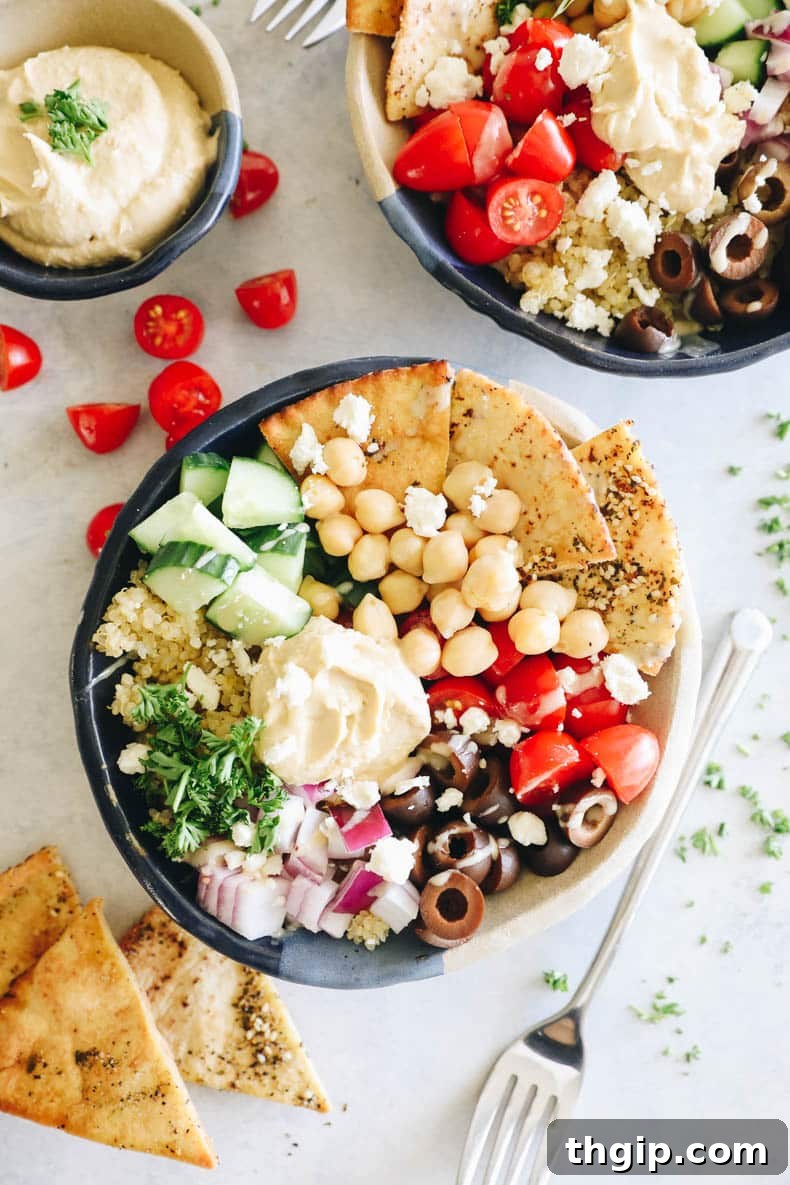 An inviting overhead photo of a completed Mediterranean bowl, ready to be enjoyed, showing all the colorful components.