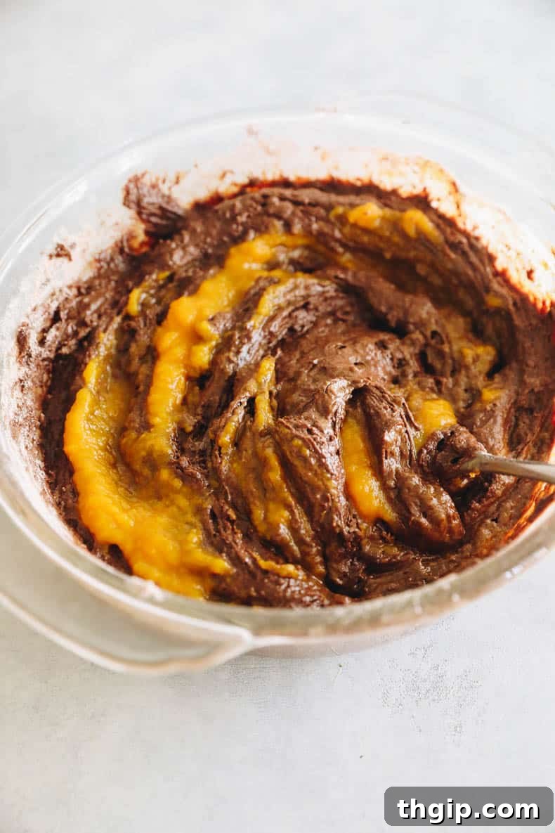 Autumn Pumpkin Brownies 5 Smooth, rich pumpkin brownie batter in a glass mixing bowl, ready for baking.