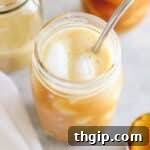 pumpkin cream cold brew in a mason jar over ice.