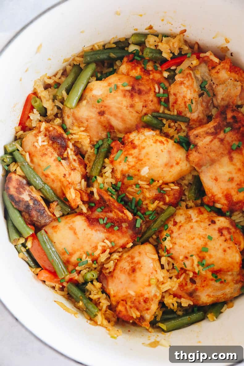 Effortless Skillet Chicken and Rice 2 one pot chicken and rice in a white dutch oven.