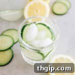 A refreshing glass of cucumber water with ice, perfectly chilled and ready to hydrate.