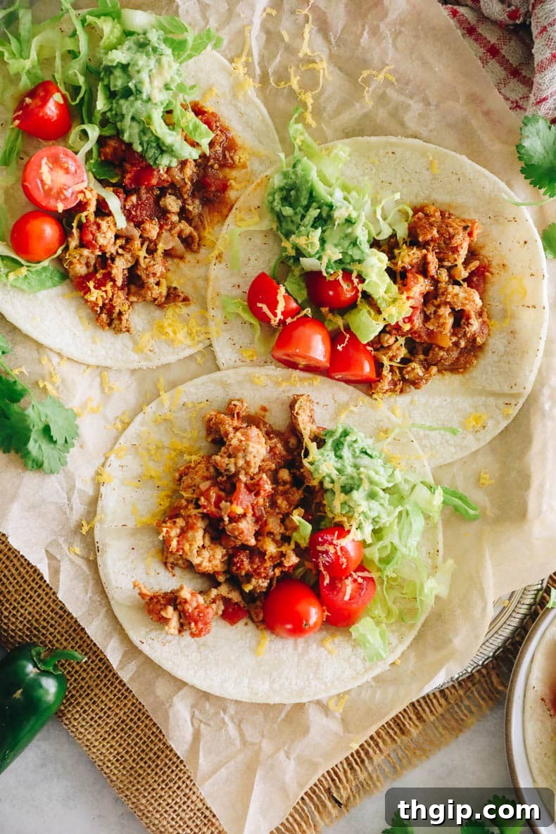 Zesty Turkey Tacos 2 Flavorful ground turkey taco meat in a vibrant taco shell with fresh toppings.