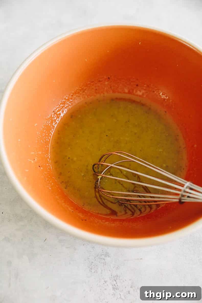 Golden Roasted Broccolini 3 lemon olive oil sauce in a bowl.