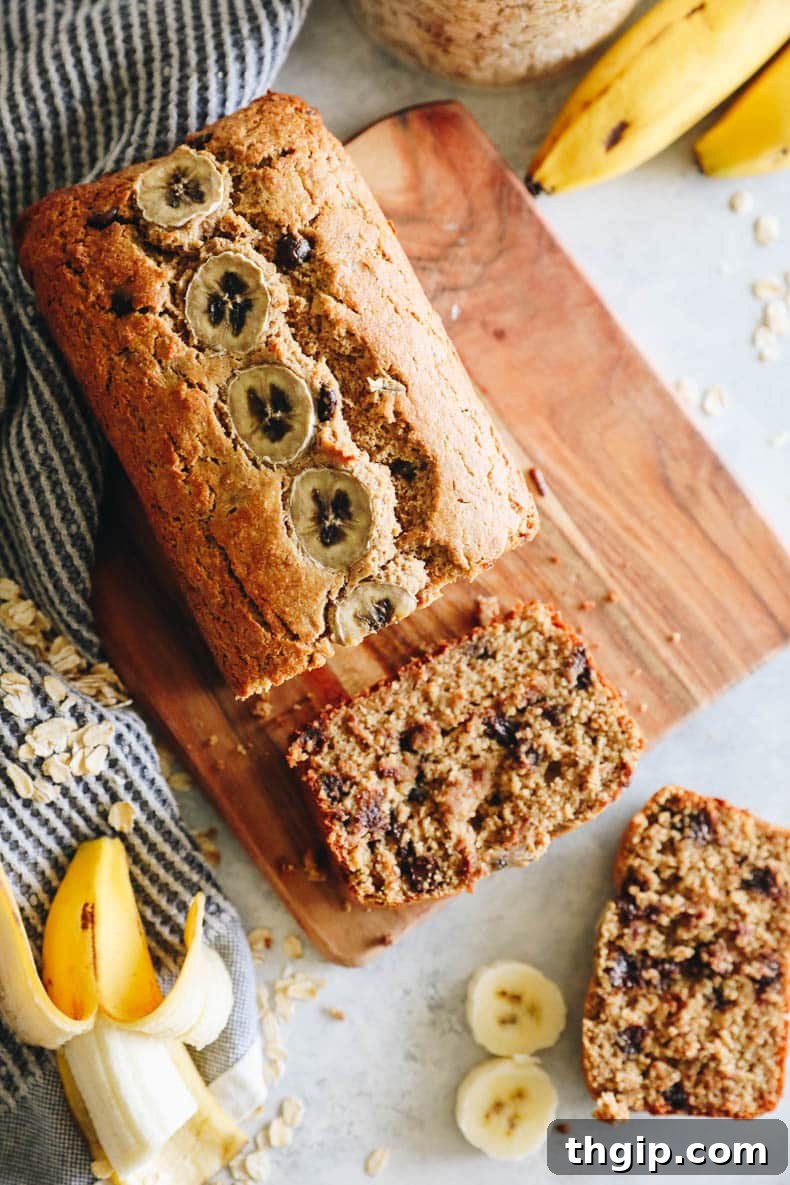Golden Oat Flour Banana Bread 8 Overhead image of a beautifully baked gluten-free banana bread loaf, showcasing its rich, golden-brown crust and inviting texture.