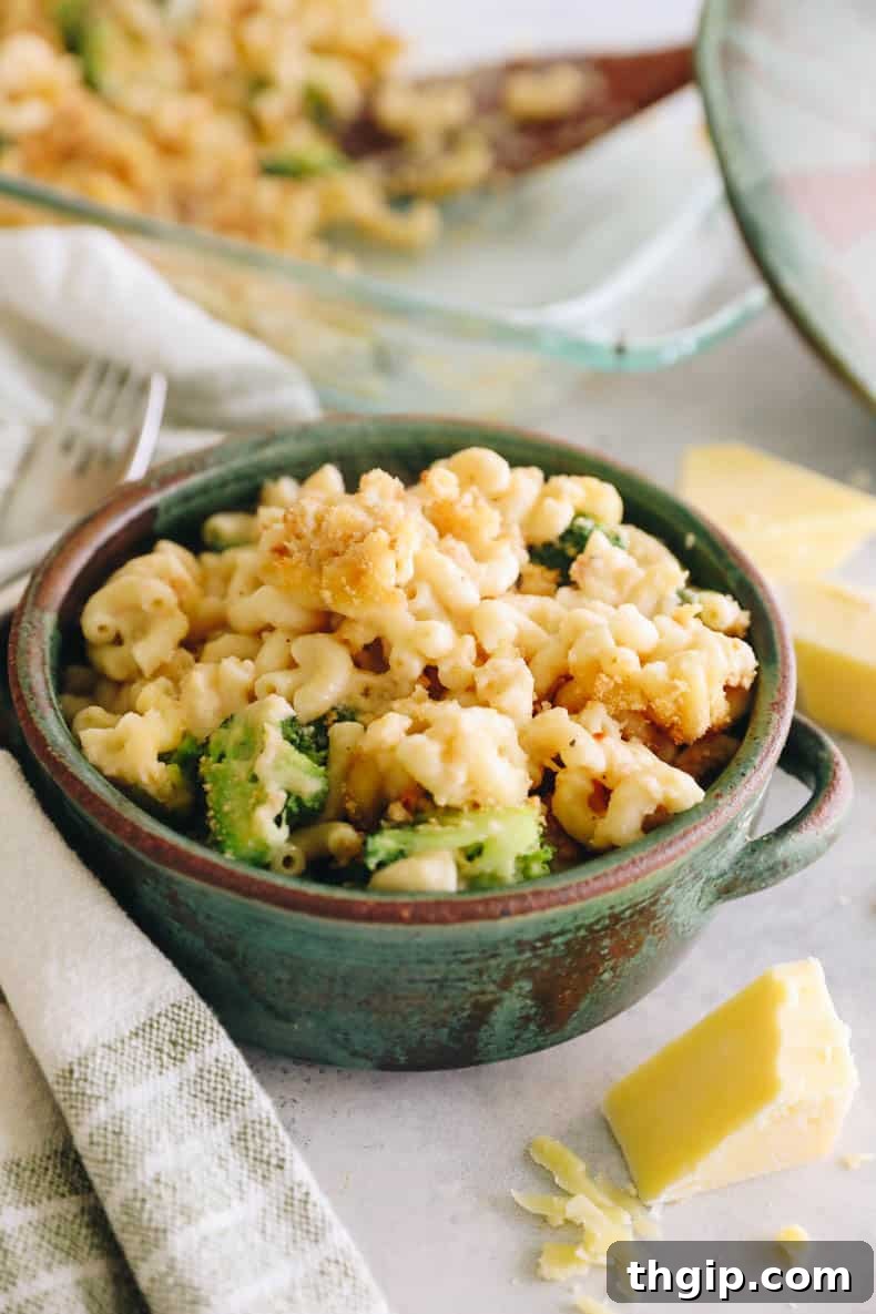 Wholesome Mac & Cheese 2 A vibrant green bowl filled with healthy baked mac and cheese, garnished with fresh herbs, ready to be enjoyed.