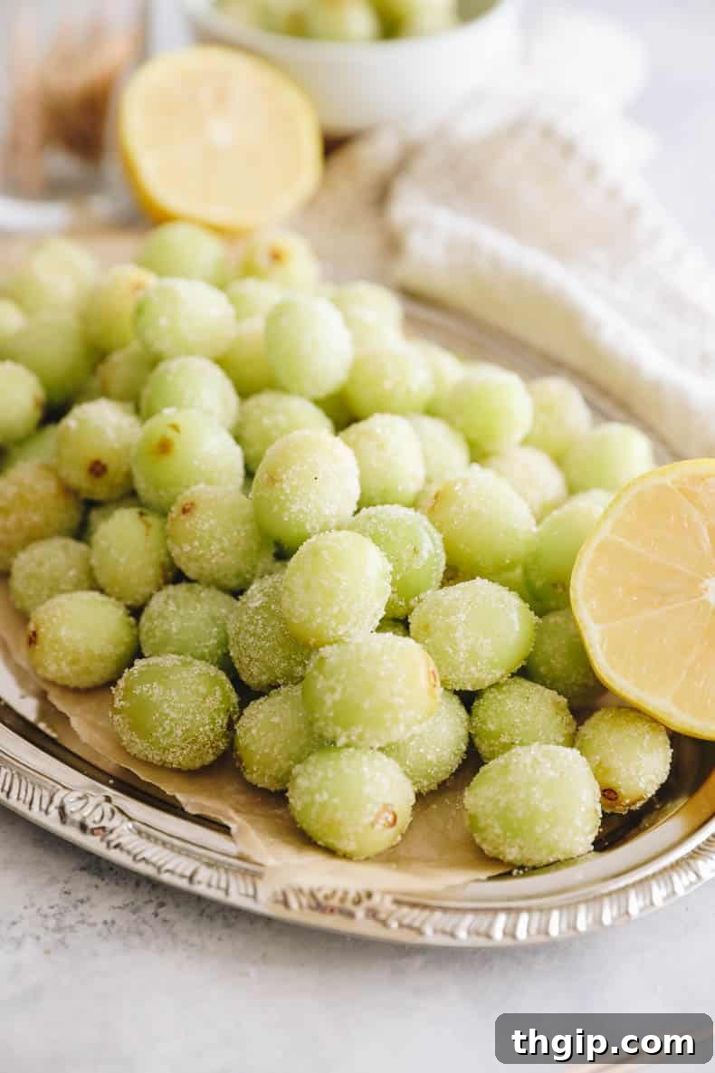 candy grapes on a silver platter.