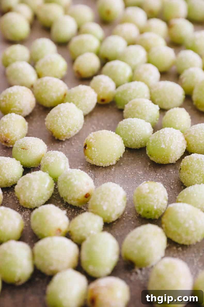 frozen candy grapes on a baking sheet.