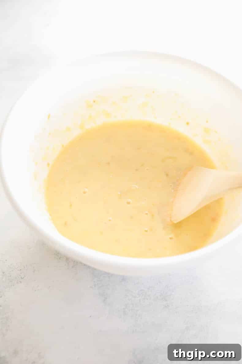 breakfast bar batter in a white mixing bowl