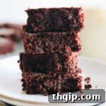 4 almond flour brownies stacked on top of each other.