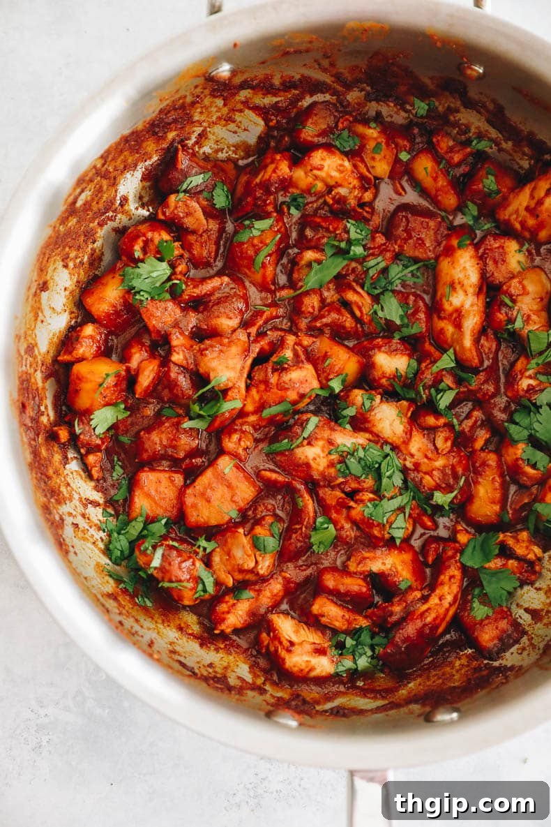 Achiote-Spiced Chicken Pastor 7 chicken al pastor cooked in a large pot.