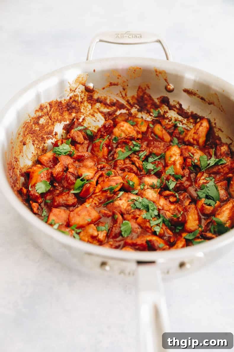 Achiote-Spiced Chicken Pastor 9 al pastor chicken cooked in a large stainless steel pot.