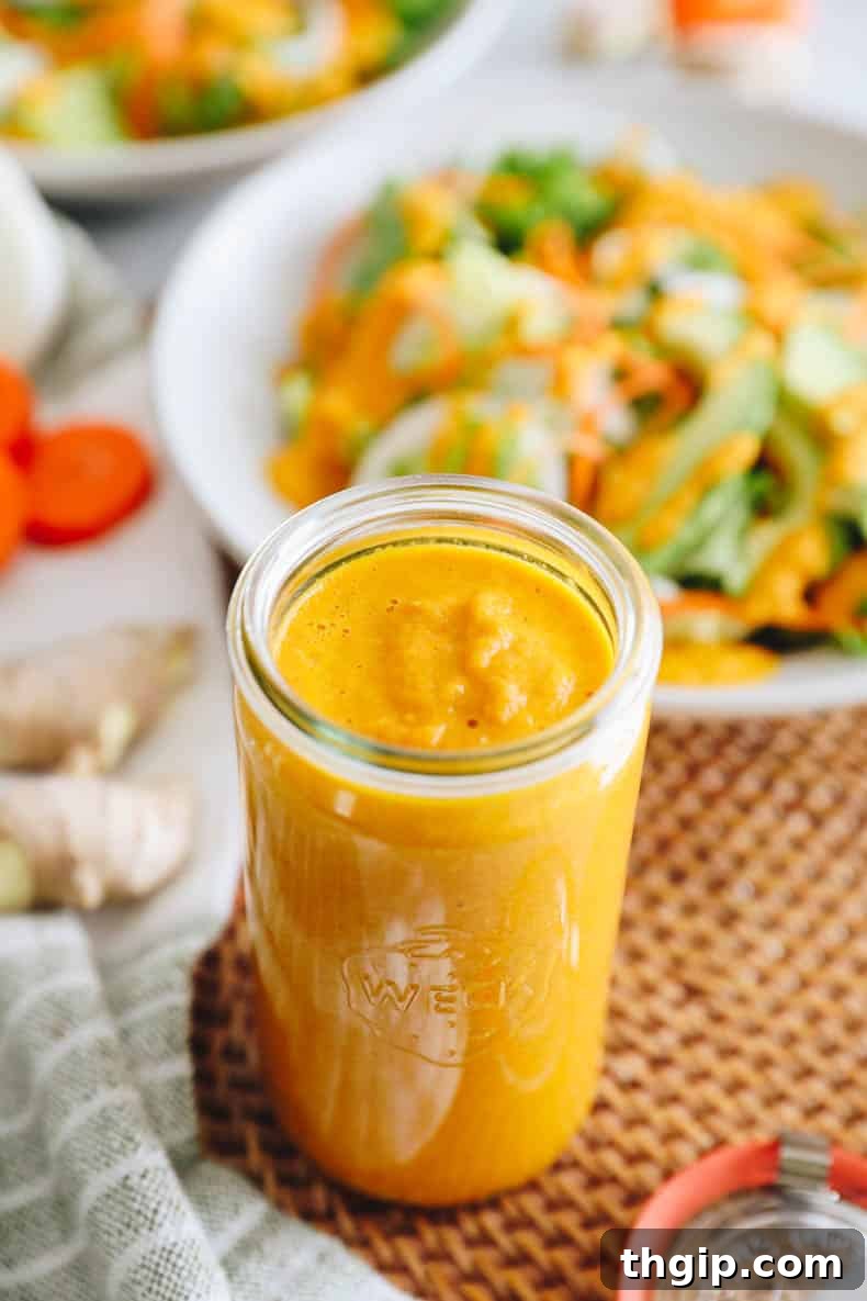 Vibrant Ginger Dressing 7 A glass jar filled with vibrant hibachi-style Japanese ginger dressing, ready to be poured.
