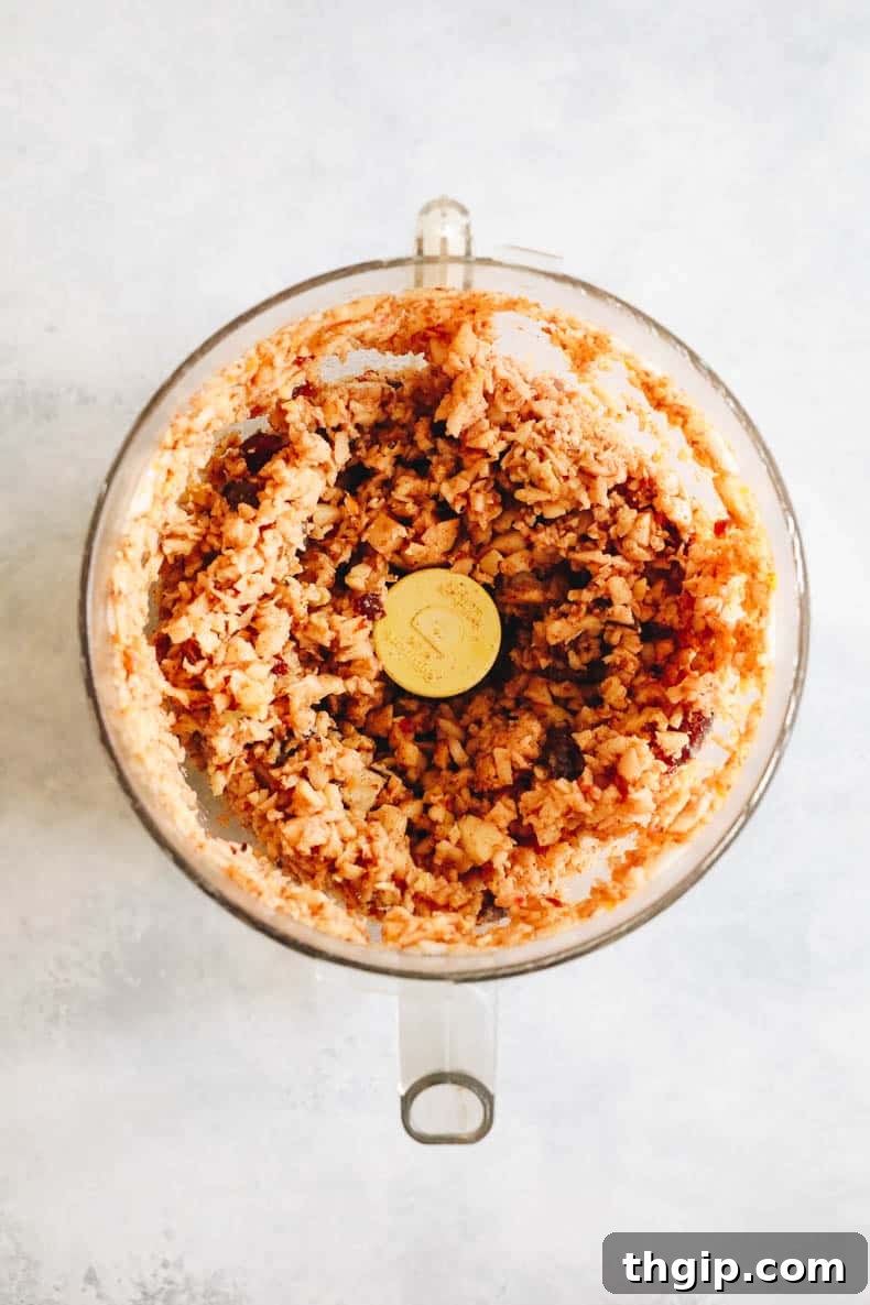 Sweet Charoset for Your Passover Seder 4 The Charoset recipe ingredients are shown after being expertly pulsed in a food processor, creating a perfectly chunky and cohesive mixture ready for serving.