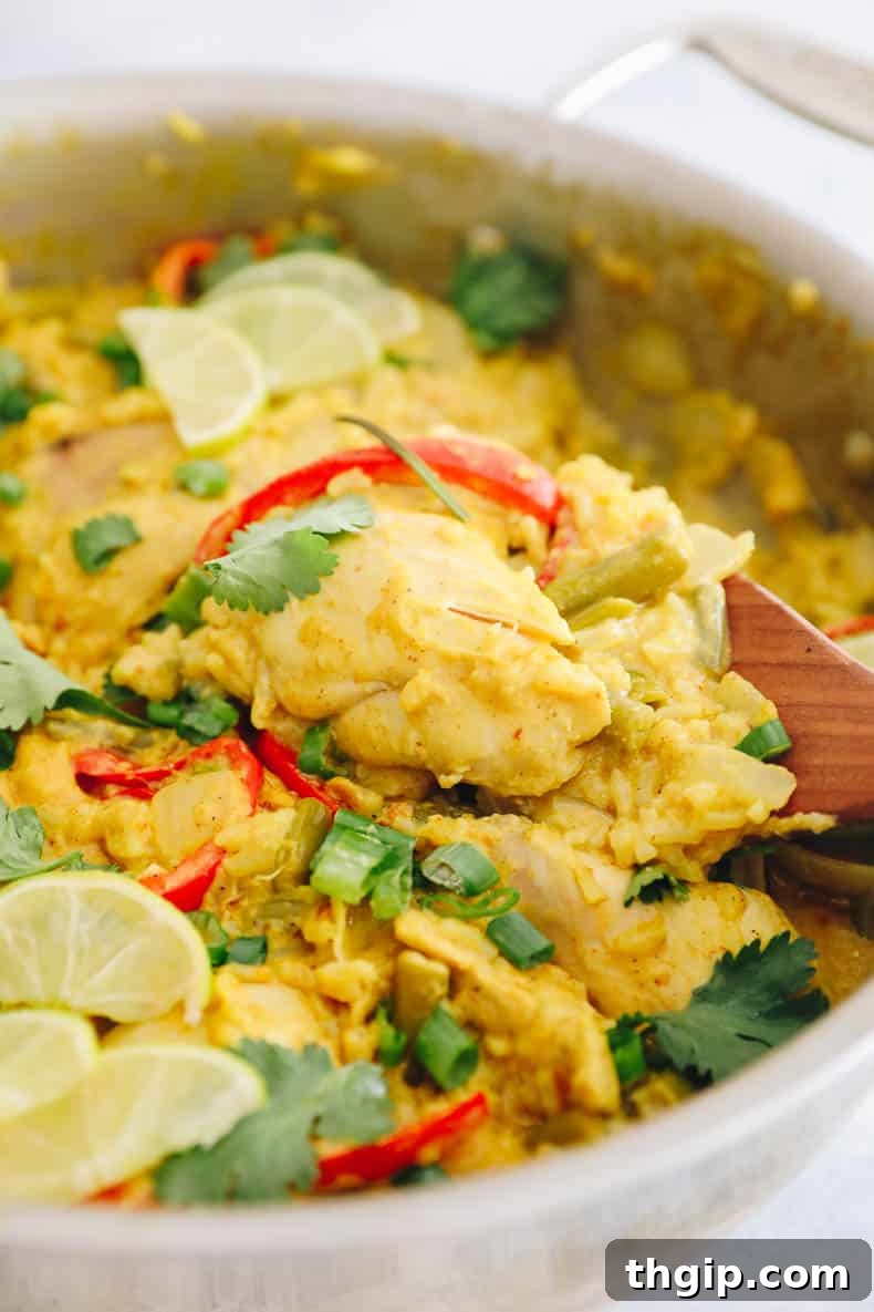 Single-Pot Tandoori Feast 2 Delicious one-pot tandoori chicken and rice simmering in a large pot, ready to serve.