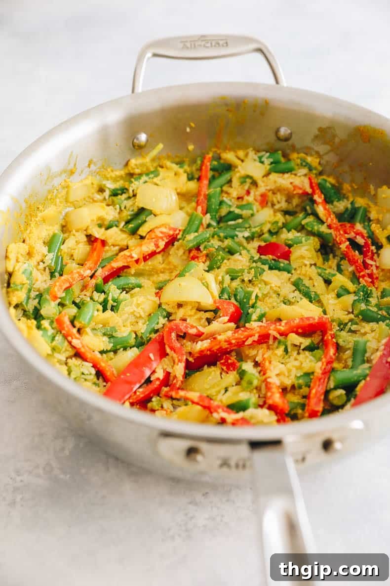 Single-Pot Tandoori Feast 5 Colorful bell peppers, green beans, and basmati rice sautéing in the same pot, building layers of flavor.