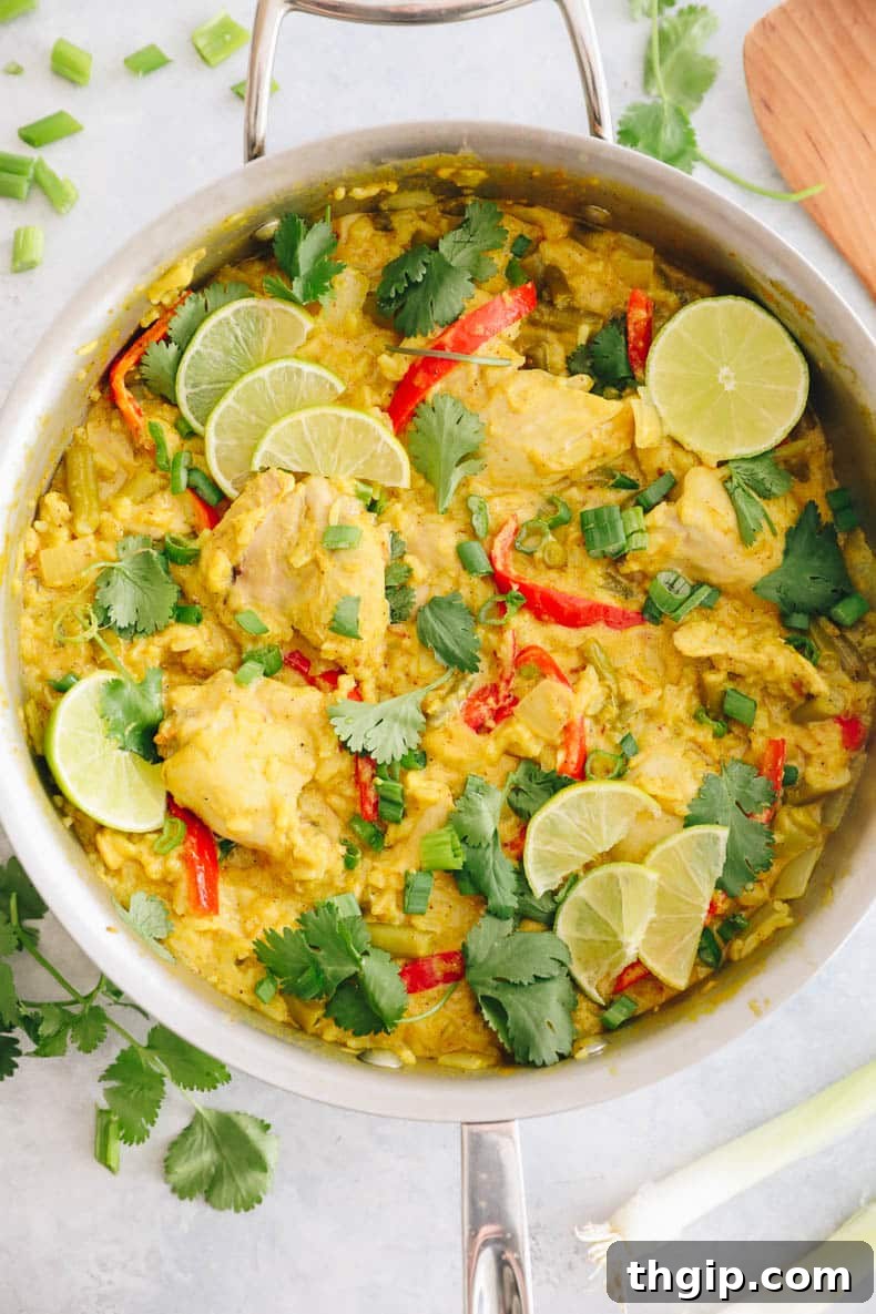 Single-Pot Tandoori Feast 8 A serving of one-pot tandoori chicken and rice in a bowl, garnished with fresh lime and cilantro.