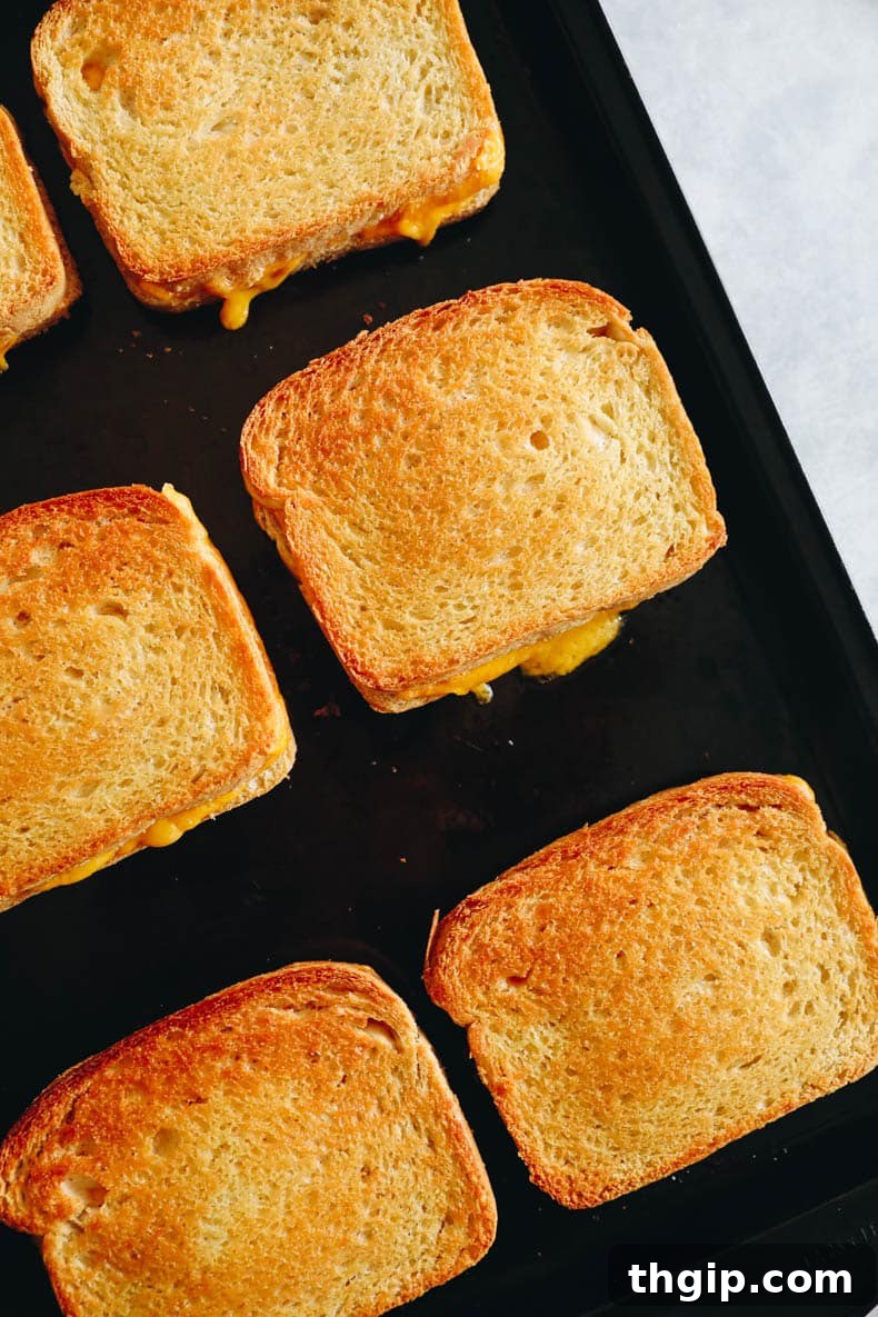 Effortless Sheet Pan Melts 5 sheet pan grilled cheese baking in the oven