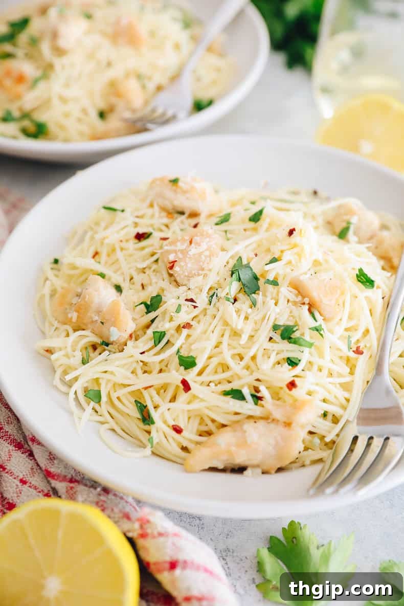 Garlic Butter Lemon Chicken 3 close-up of shallow white bowl with copycat olive garden chicken scampi