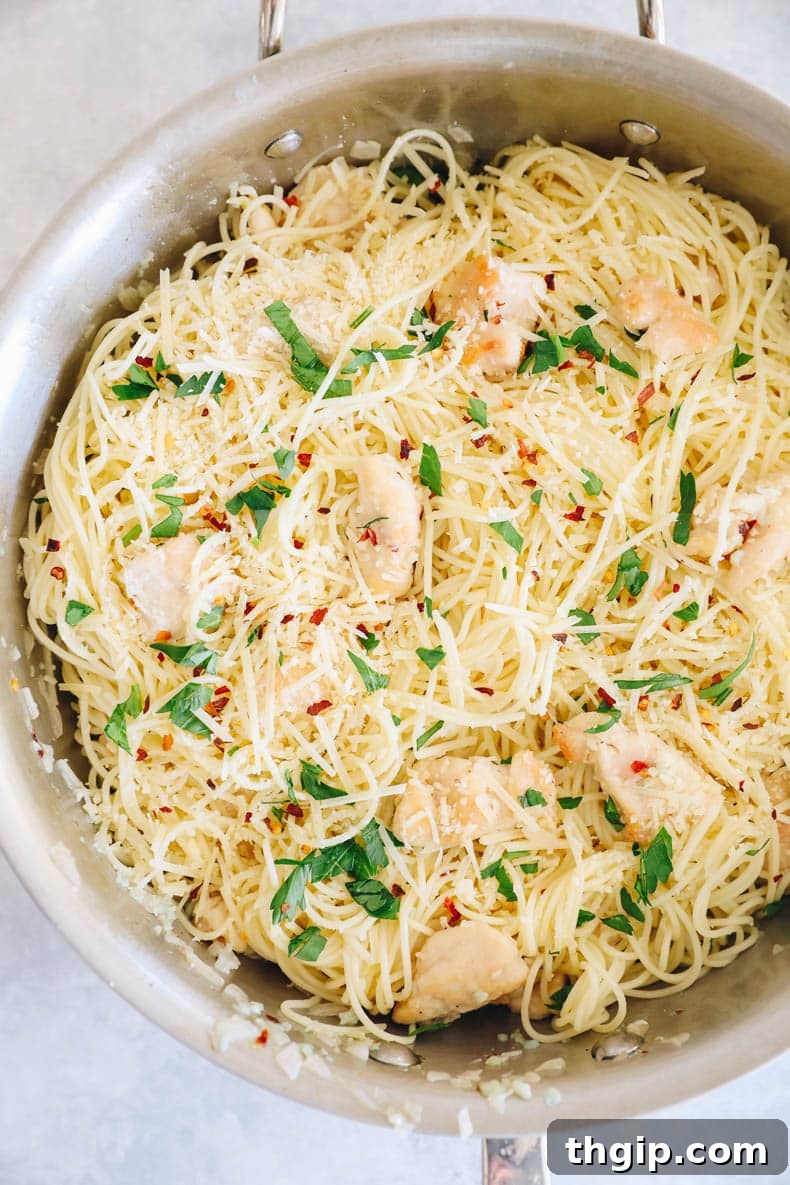 Garlic Butter Lemon Chicken 7 copycat olive garden chicken scampi in a large pot topped with parsley, chili flakes and parmesan.