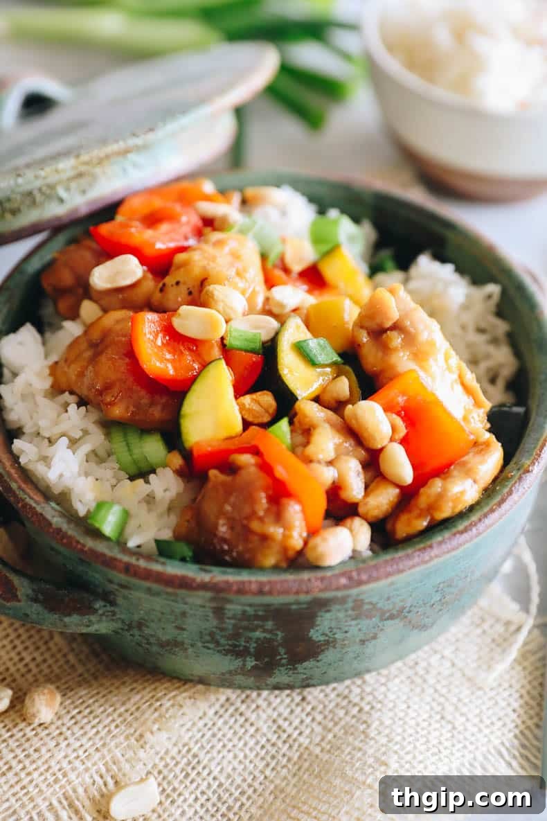 close-up of cooked kung pao chicken, garnished and ready.