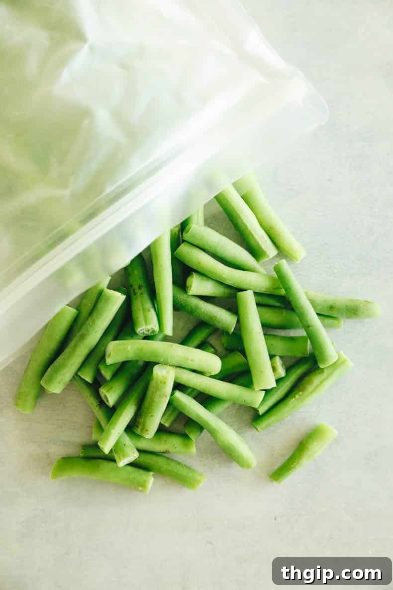 A reusable freezer bag filled with perfectly flash-frozen green beans, expertly sealed with minimal air to prevent freezer burn.