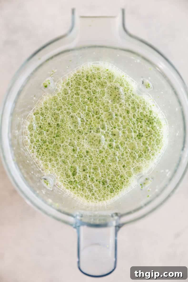 Zesty One-Pan Cilantro Lime Chicken and Rice 5 Smooth and vibrant blended cilantro lime sauce in a blender cup.